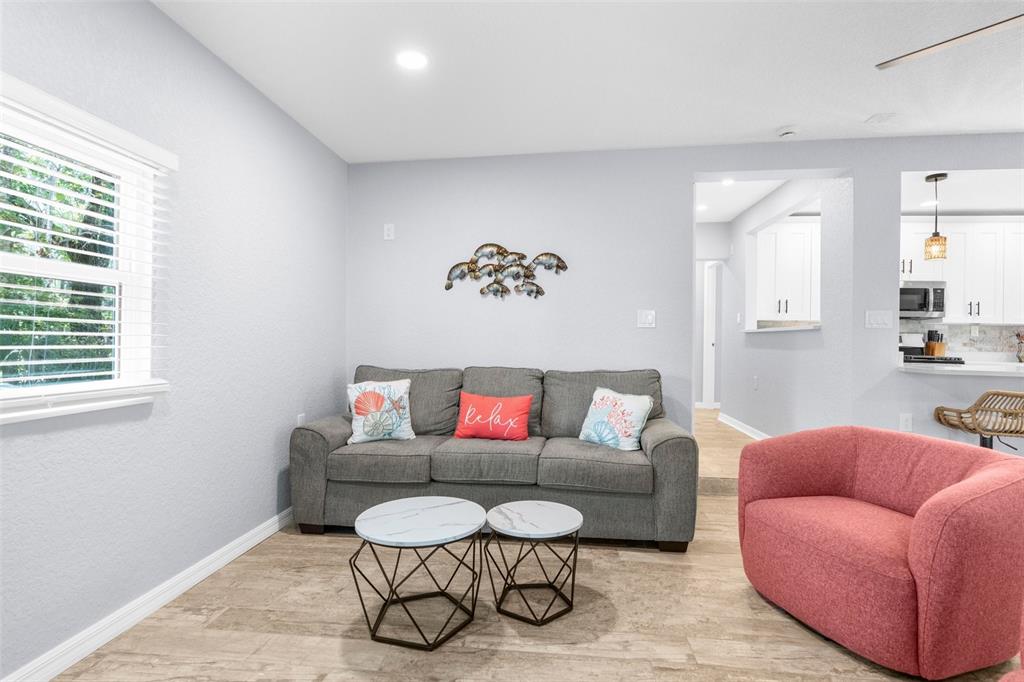 5421 Gay Street Weeki Wachee, FL 34607 - Photo 14 of 55 a living room with furniture and a window