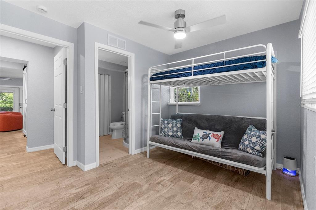 5421 Gay Street Weeki Wachee, FL 34607 - Photo 29 of 55 a bedroom with furniture and a window