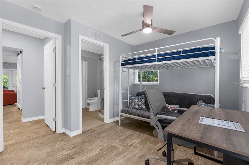 5421 Gay Street Weeki Wachee, FL 34607 - Photo 32 of 55 a view of a workspace with furniture and a ceiling fan