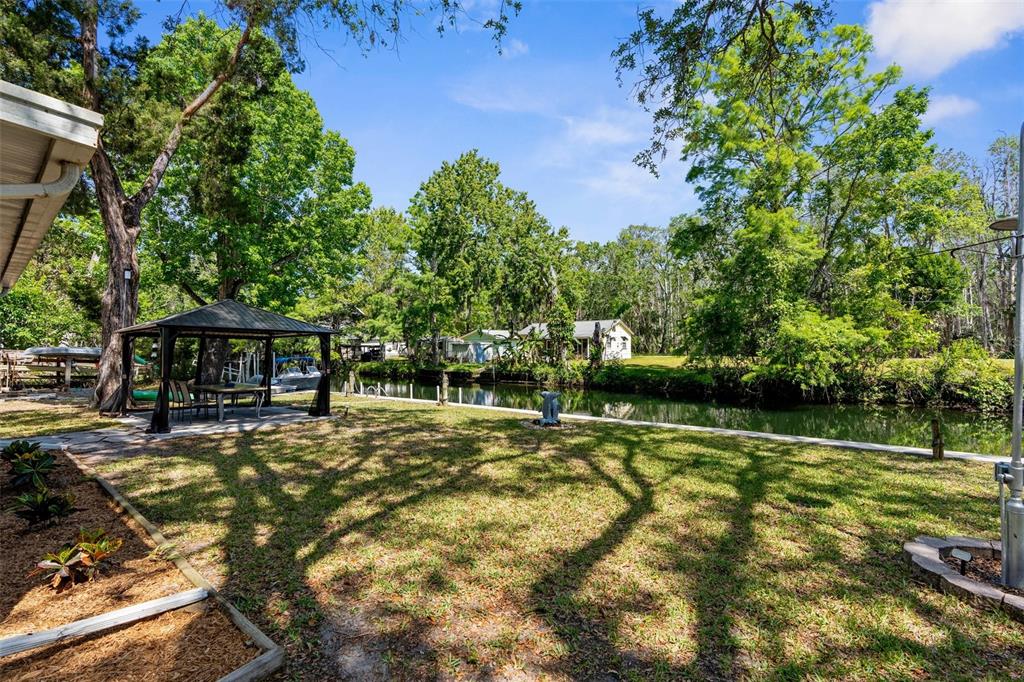 5421 Gay Street Weeki Wachee, FL 34607 - Photo 38 of 55 a view of a house with swimming pool