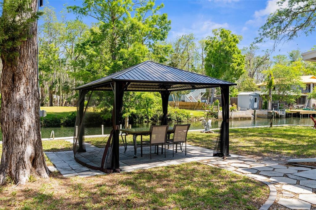 5421 Gay Street Weeki Wachee, FL 34607 - Photo 39 of 55 a view of a swimming pool with a patio