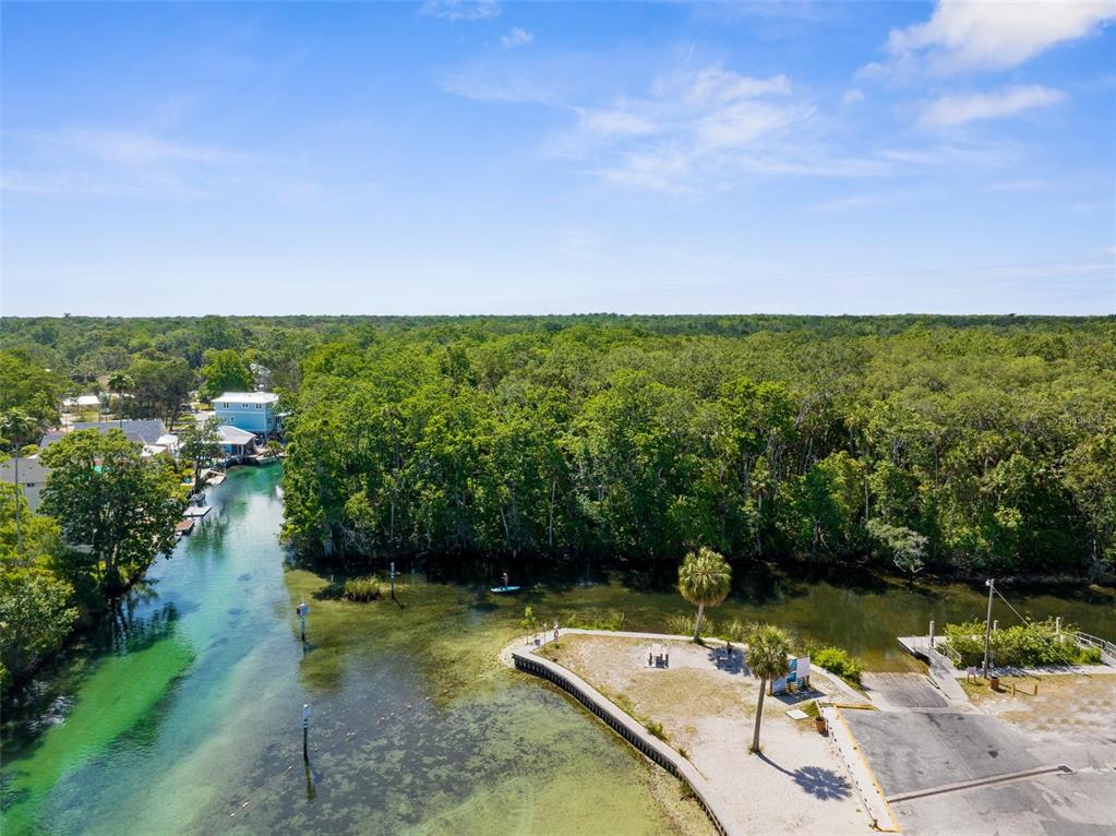 5421 Gay Street Weeki Wachee, FL 34607 - Photo 49 of 55 a view of a lake with a yard