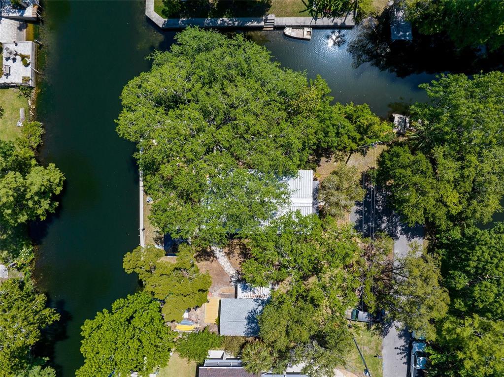 5421 Gay Street Weeki Wachee, FL 34607 - Photo 54 of 55 an aerial view of a house with a yard and lake view