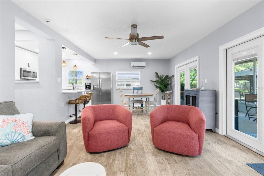 5421 Gay Street Weeki Wachee, FL 34607 - Photo 10 of 55 a living room with furniture and a ceiling fan