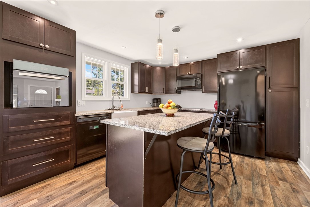 44 Friel Road Henrietta, NY 14623 - Photo 7 of 24 expanded and opened up the kitchen with abundant cabinets and shelves