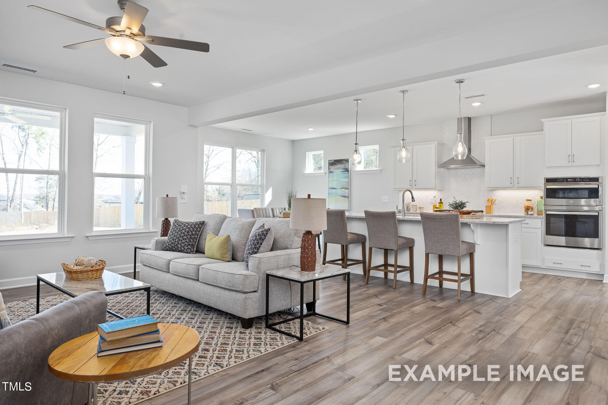 62 Golden Leaf Farms Road Angier, NC 27501 - Photo 13 of 31 a living room with furniture kitchen view and a large window