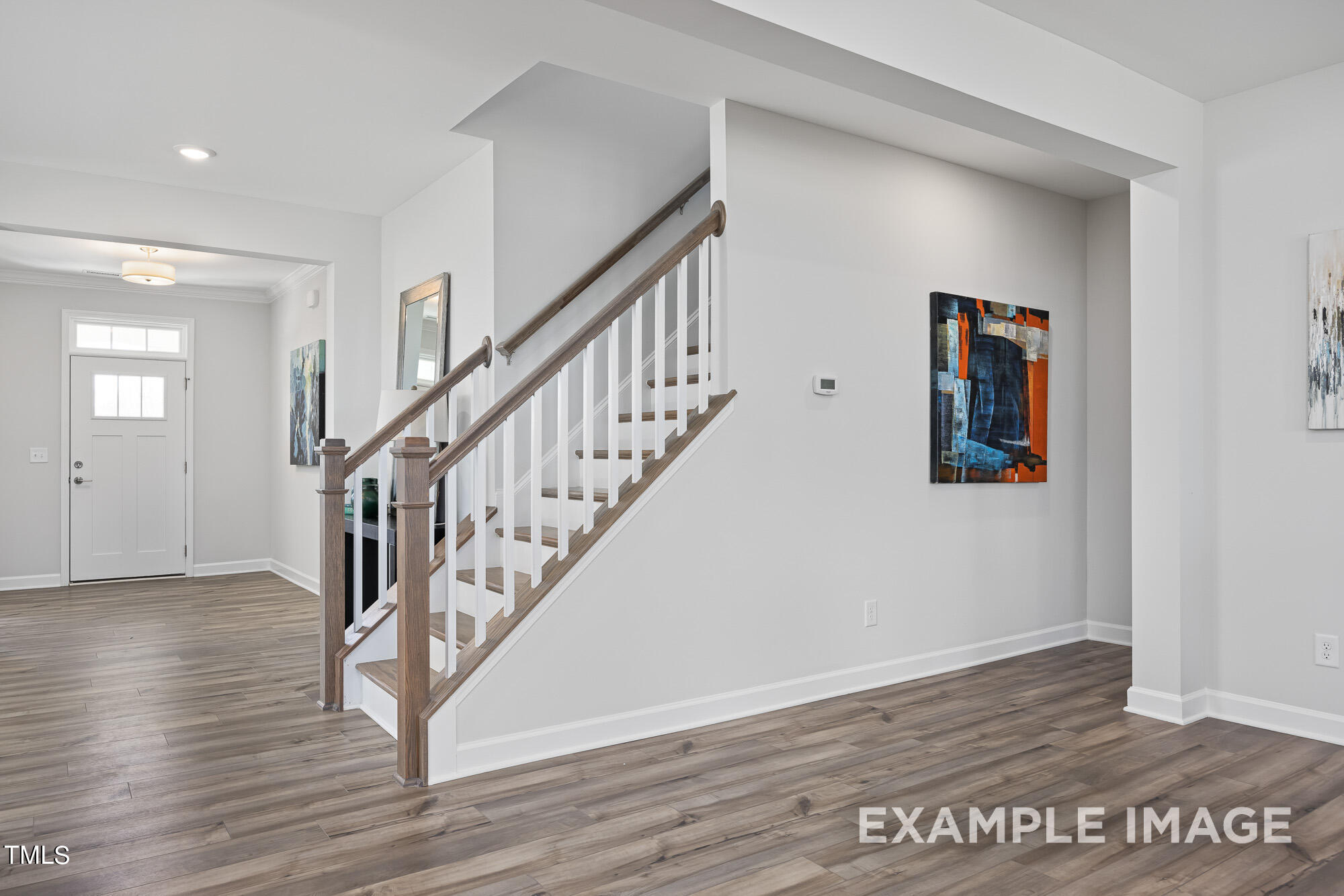 62 Golden Leaf Farms Road Angier, NC 27501 - Photo 17 of 31 a view of a hallway with wooden floor and staircase