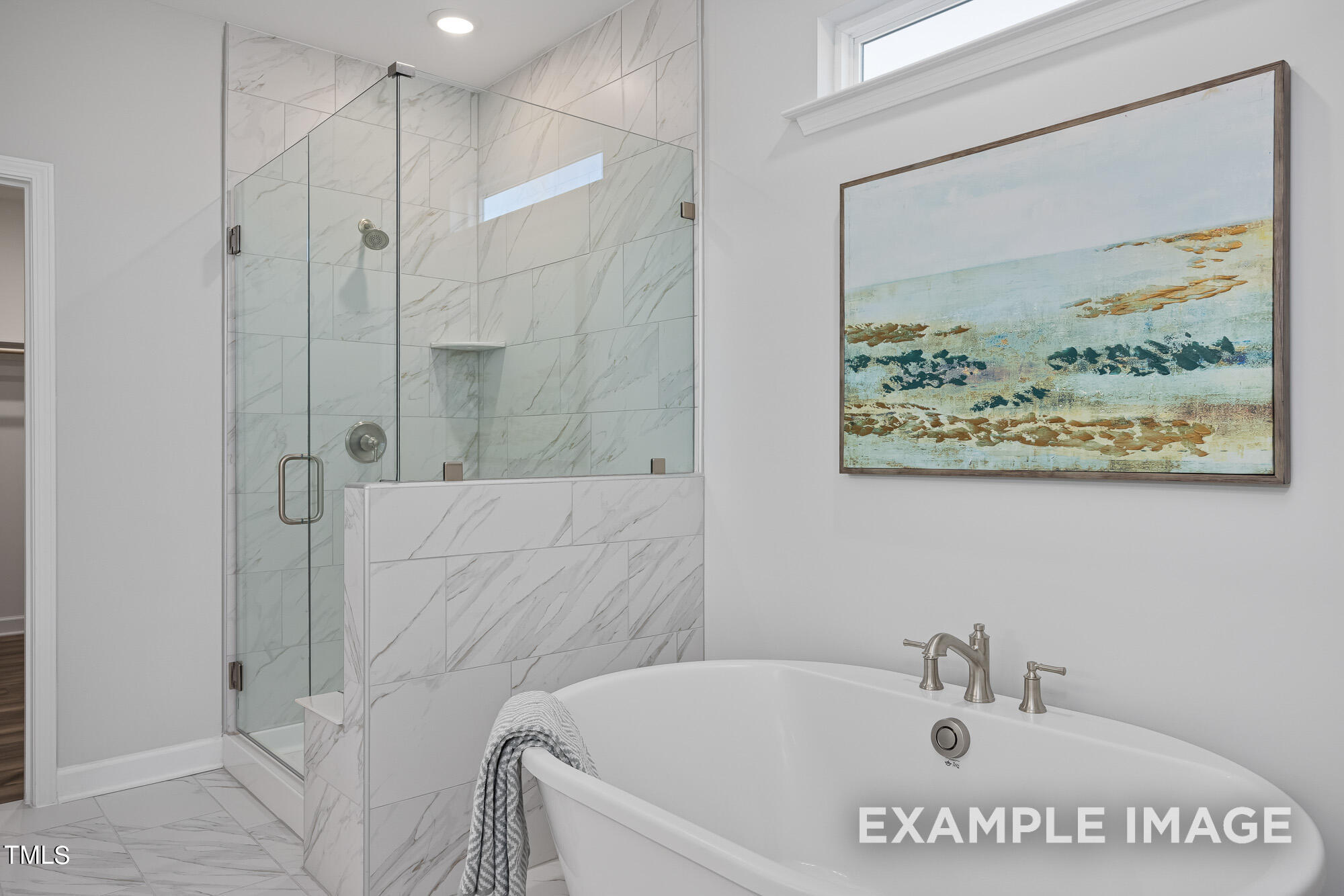 62 Golden Leaf Farms Road Angier, NC 27501 - Photo 21 of 31 a bath tub sitting next to a white sink and vanity