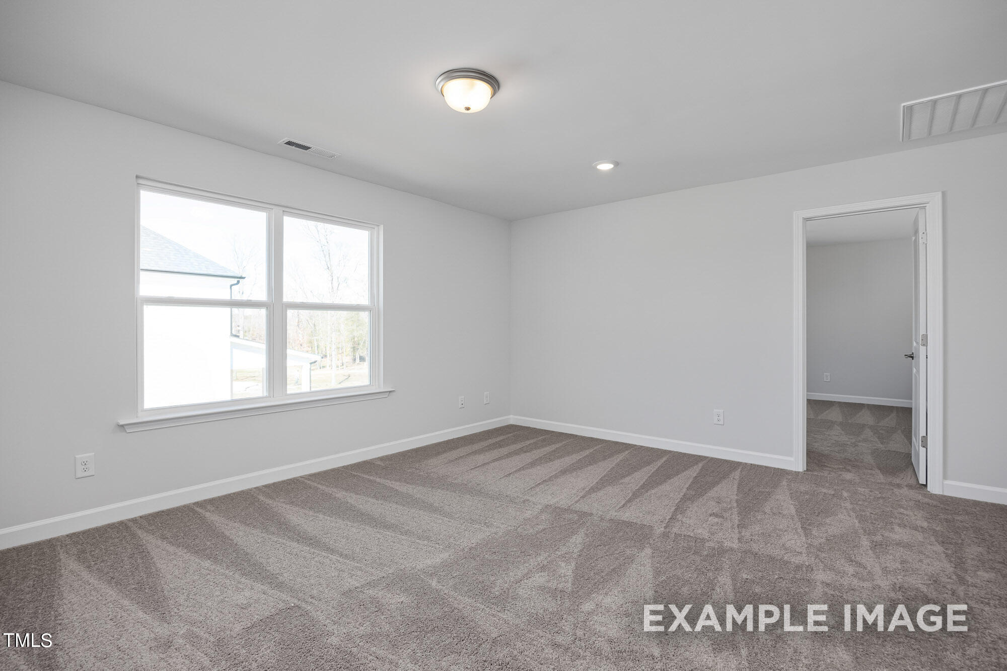 62 Golden Leaf Farms Road Angier, NC 27501 - Photo 24 of 31 an empty room with a window