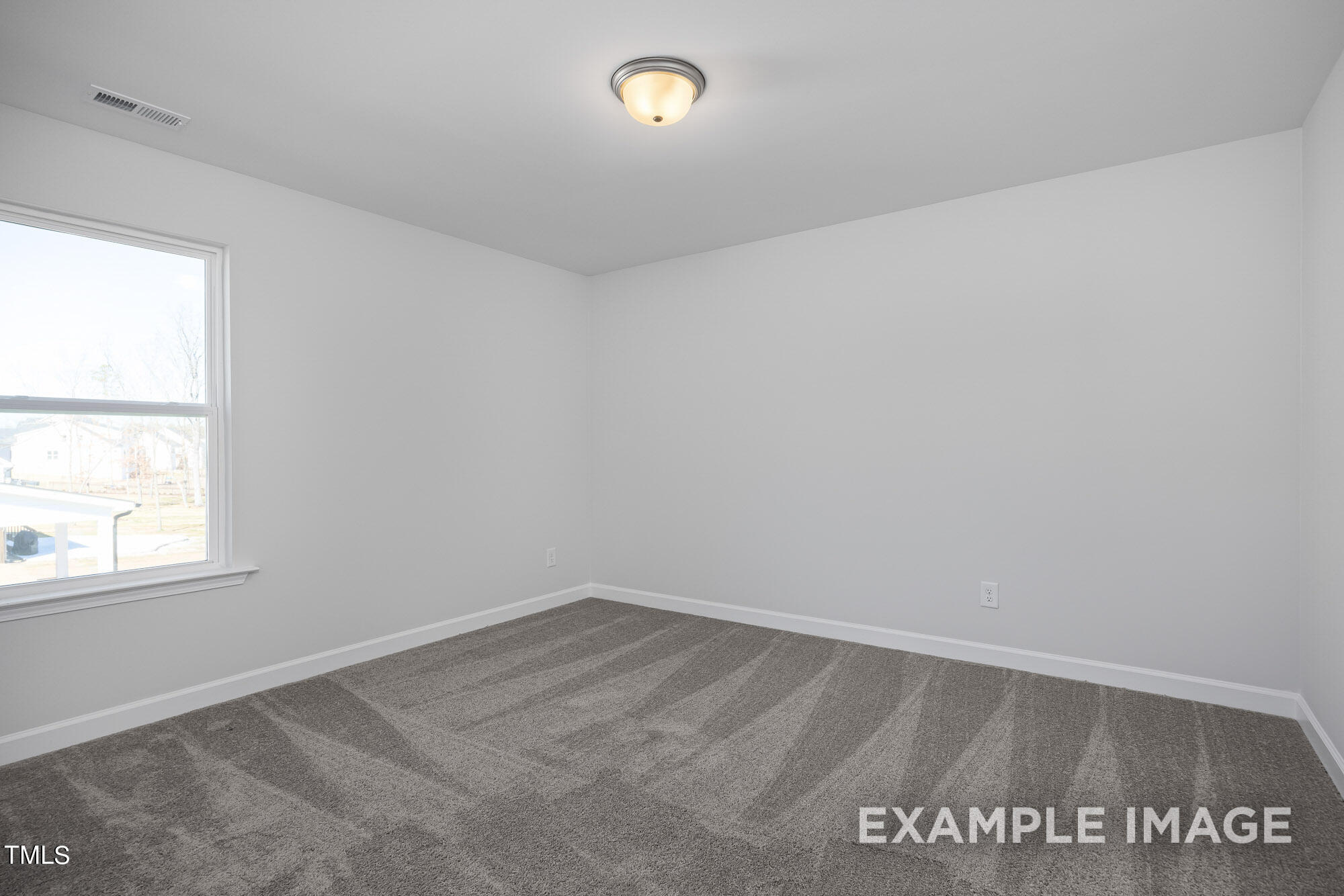 62 Golden Leaf Farms Road Angier, NC 27501 - Photo 26 of 31 an empty room with a window