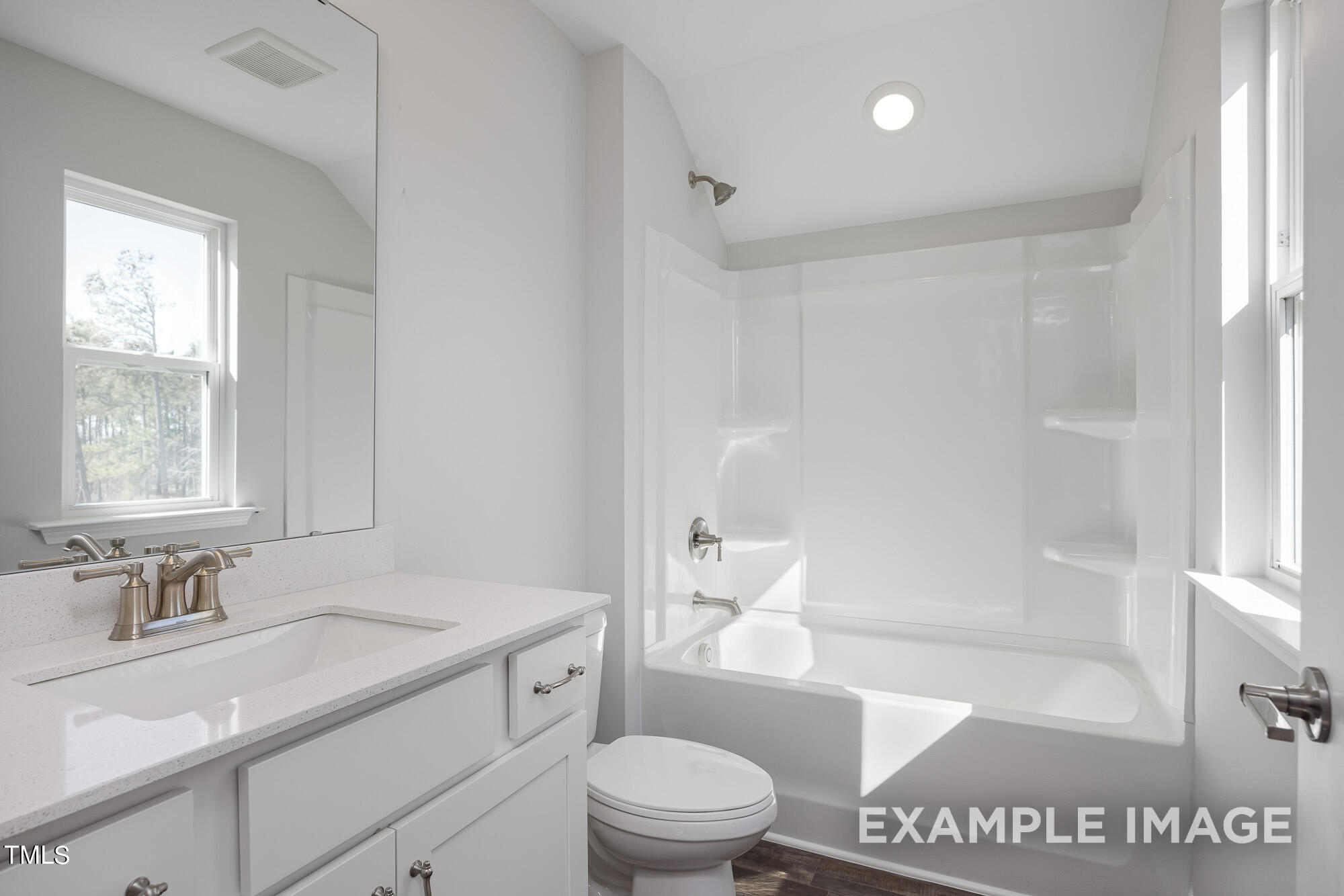 62 Golden Leaf Farms Road Angier, NC 27501 - Photo 27 of 31 a bathroom with a sink a toilet a tub and shower