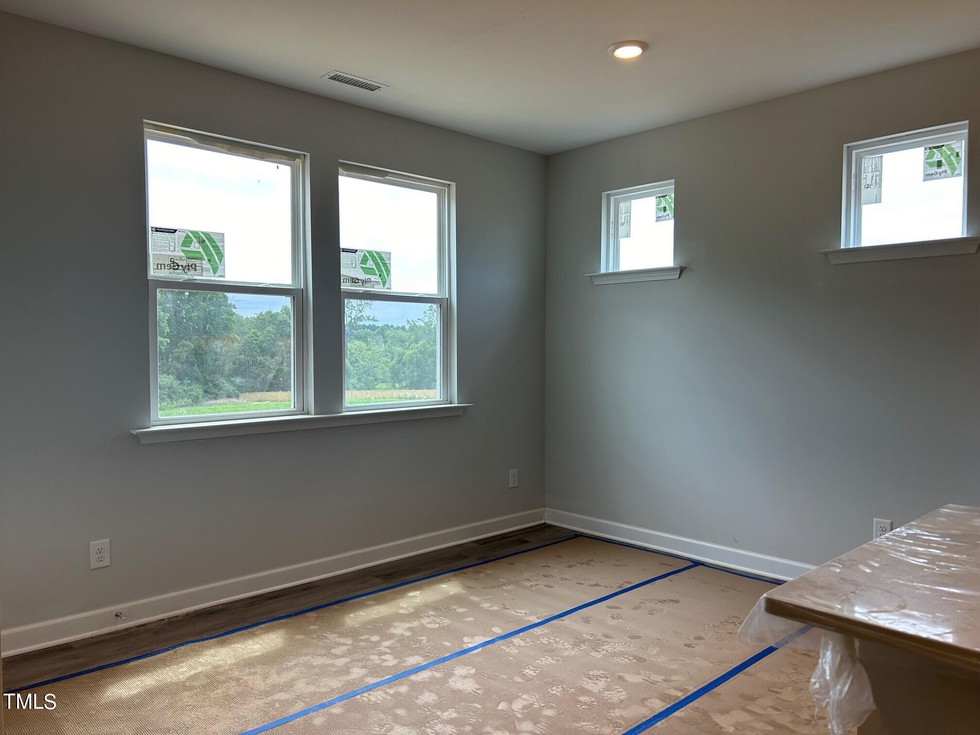 62 Golden Leaf Farms Road Angier, NC 27501 - Photo 6 of 31 a view of an empty room and window