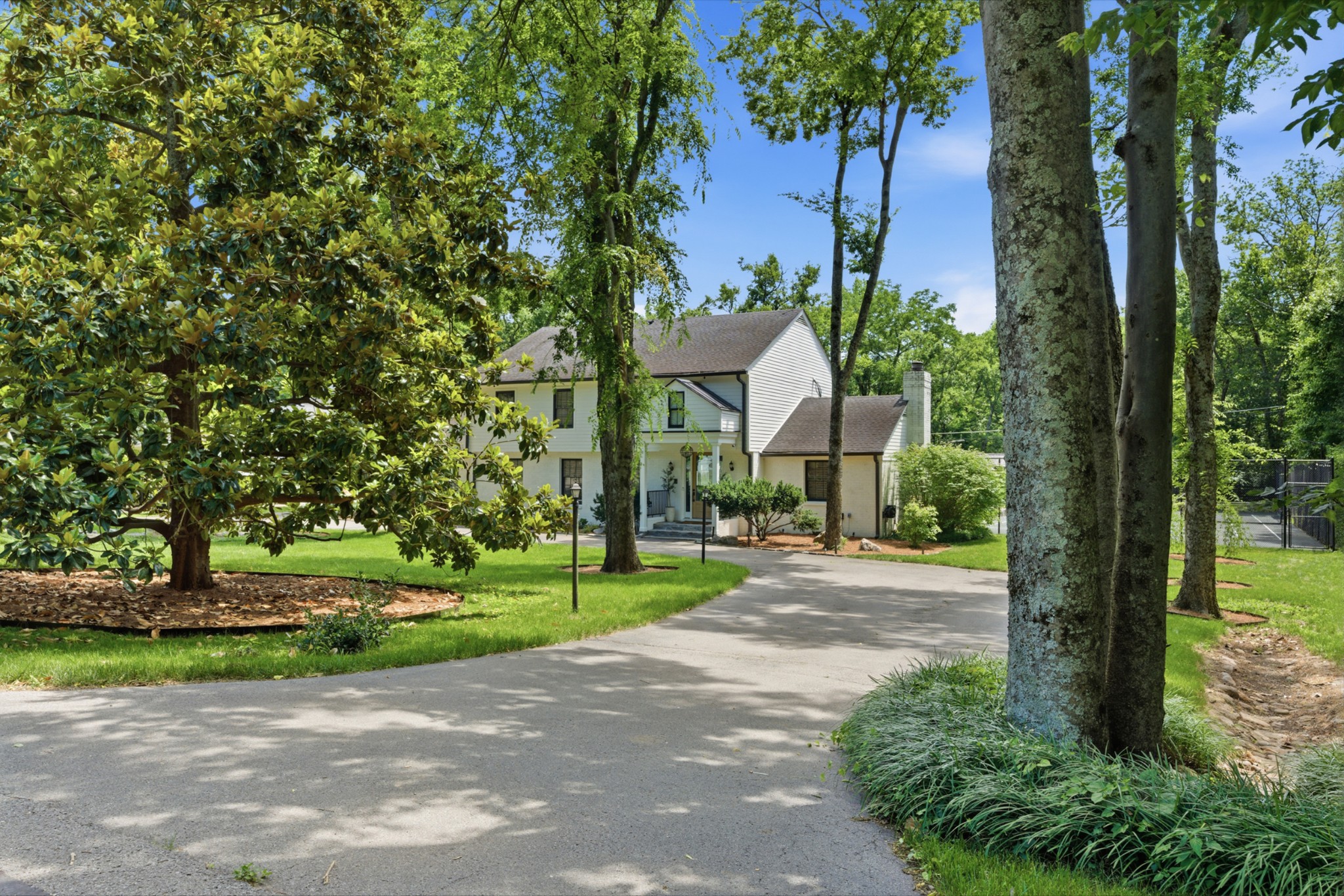 2419 Valley Brook Road Nashville, TN 37215 - Photo 74 of 80 a pathway of a house with a yard and large trees