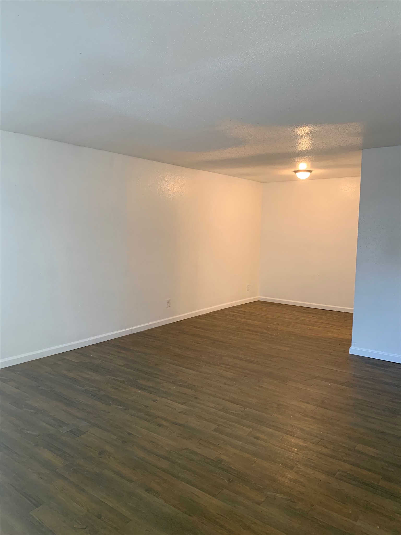 6200 West Tidwell Road, Unit 2701 Houston, TX 77092 - Photo 10 of 10 a view of an empty room with wooden floor