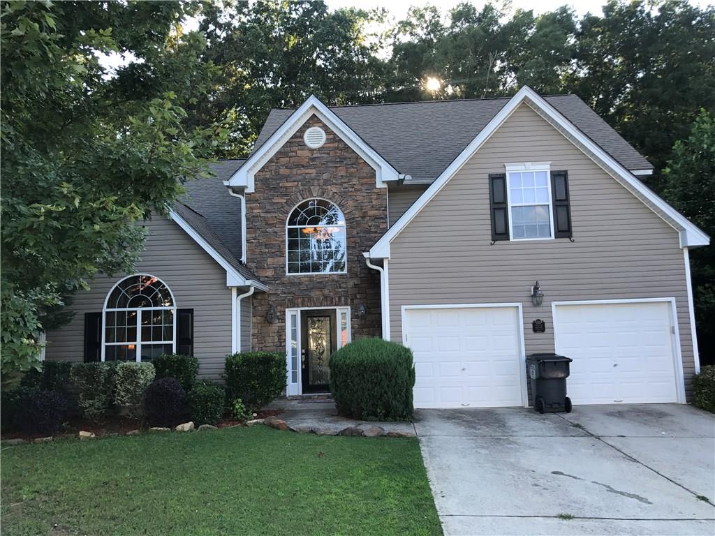 2232 Corkscrew Way Villa Rica, GA 30180 - Photo 1 of 1 a front view of a house with a yard and garage