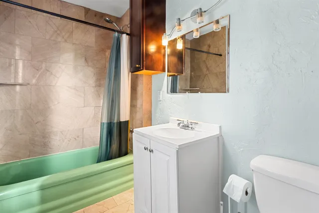 a kitchen with stainless steel appliances a refrigerator sink and stove