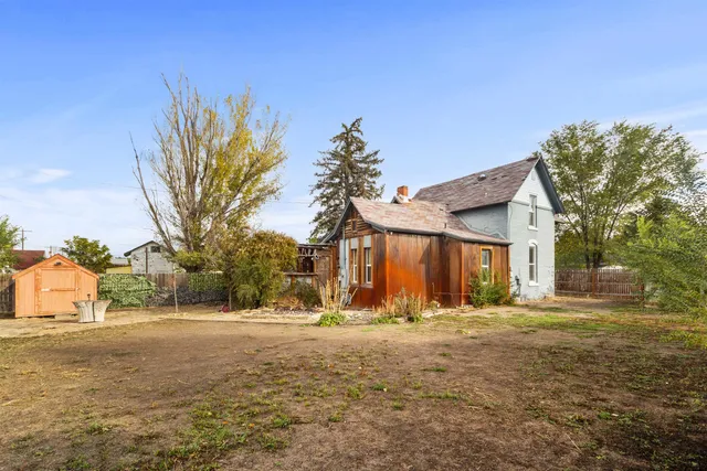 a view of large house with a yard