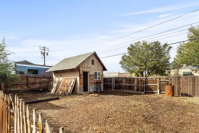 a view of house with a yard