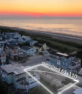 a roof deck with table and chairs and potted plants