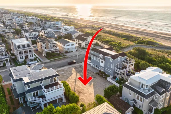 an outdoor view of the house with ocean view