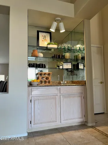 a kitchen with stainless steel appliances granite countertop a sink and cabinets