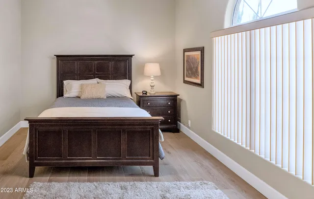 a bedroom with a bed and window