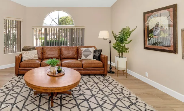 a living room with furniture and a large window