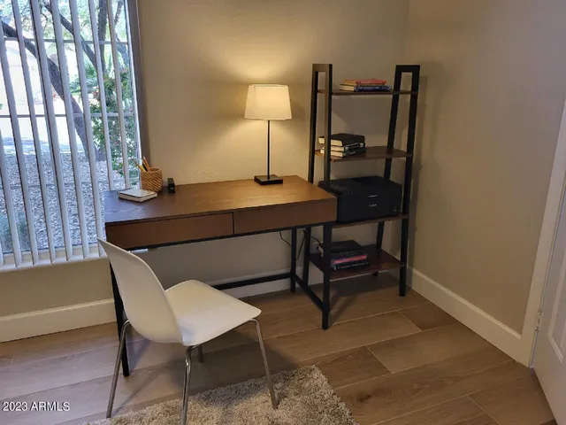 a view of a workspace with furniture