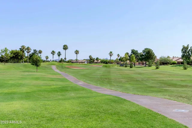 a view of a golf course with a big yard