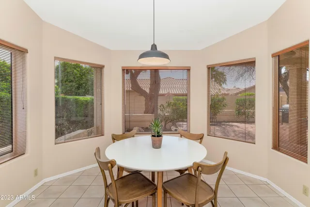 a dining room with furniture and window