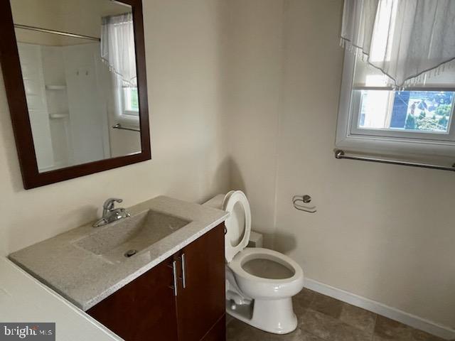 108 South Kenhorst Boulevard Reading, PA 19607 - Photo 12 of 30 a bathroom with a toilet a sink a window and mirror