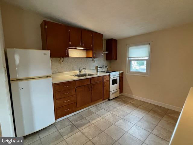 108 South Kenhorst Boulevard Reading, PA 19607 - Photo 20 of 30 a kitchen with a refrigerator sink and cabinets