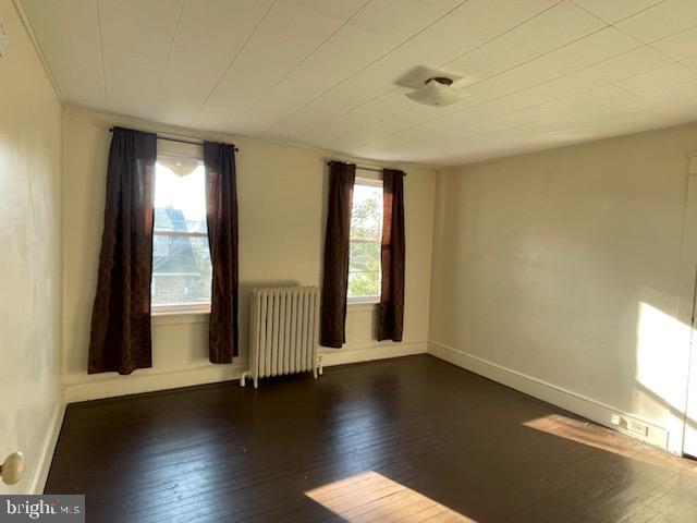 108 South Kenhorst Boulevard Reading, PA 19607 - Photo 10 of 30 an empty room with wooden floor and windows with curtains