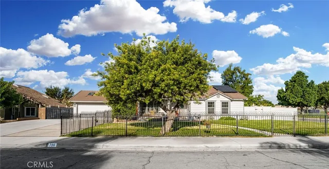 a view of street along with residential houses
