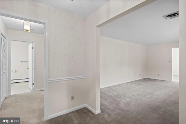 an empty room with entrance door