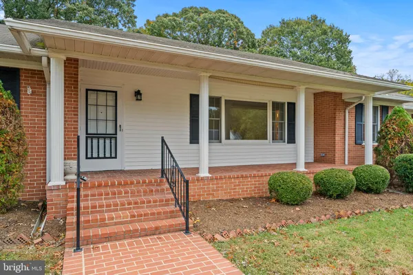a front view of a house with a porch
