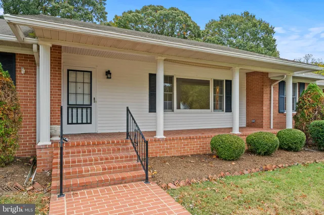 a front view of a house with a porch