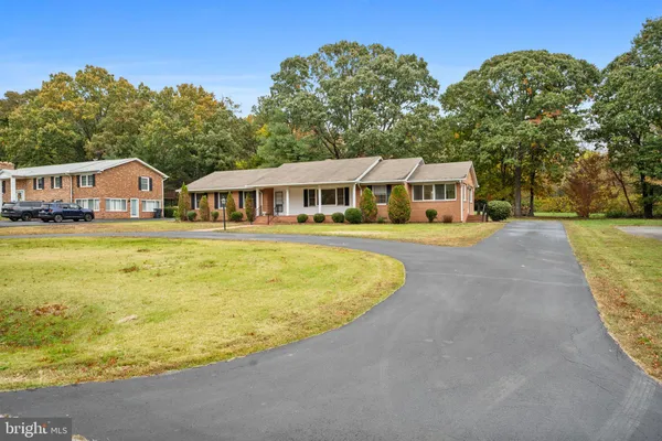a view of a house with swimming pool and porch