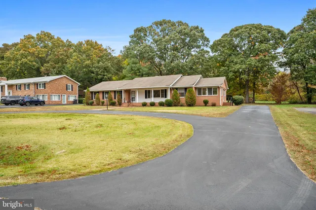 a view of a house with swimming pool and porch