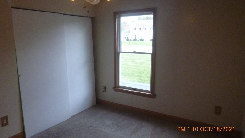 37 Henry Marsh Road Dudley, MA 01571 - Photo 19 of 28 a view of an empty room with a window