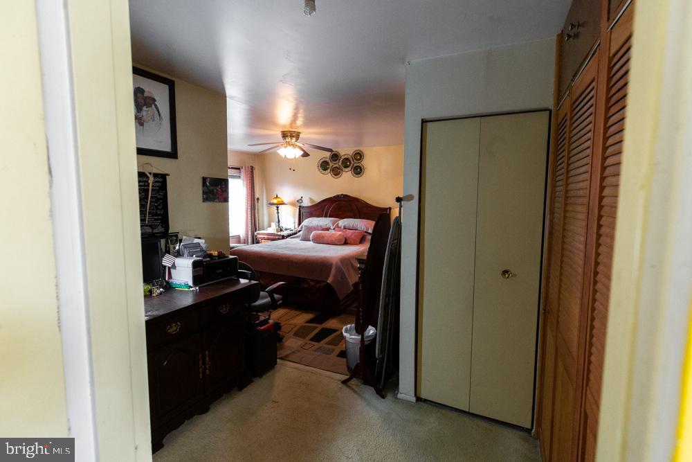 11200 Cherry Hill Road, Unit 54 Beltsville, MD 20705 - Photo 12 of 18 a bedroom with a bed and a lamp
