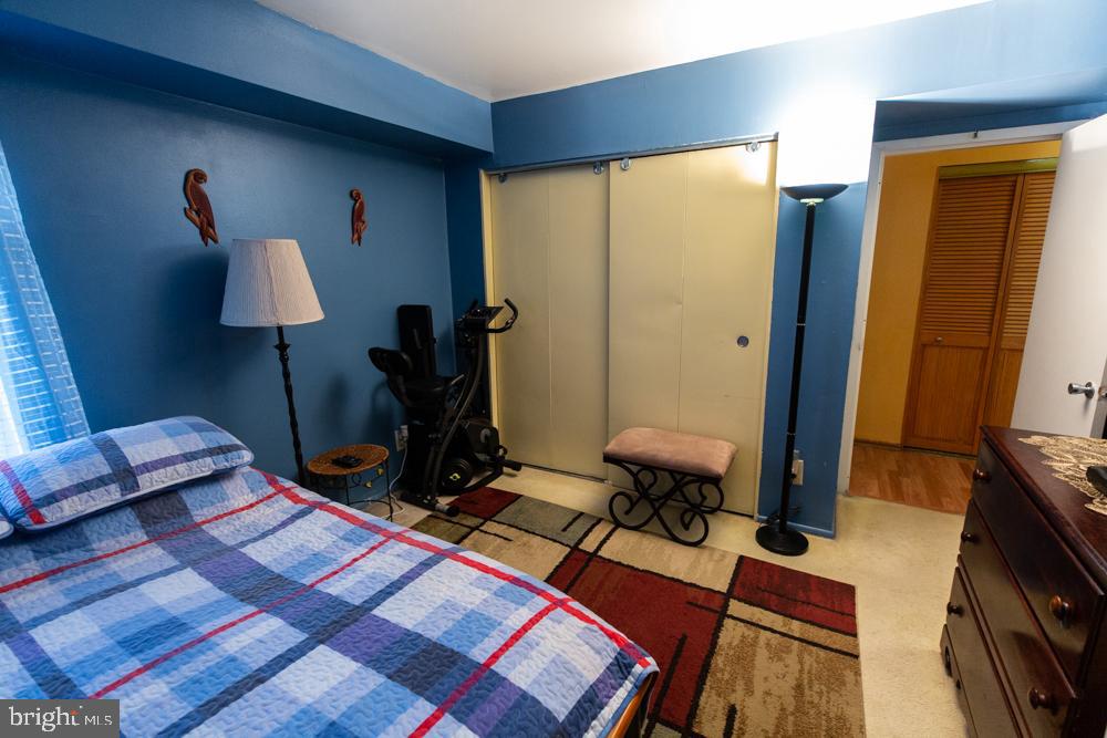 11200 Cherry Hill Road, Unit 54 Beltsville, MD 20705 - Photo 15 of 18 a room with furniture and a flat screen tv