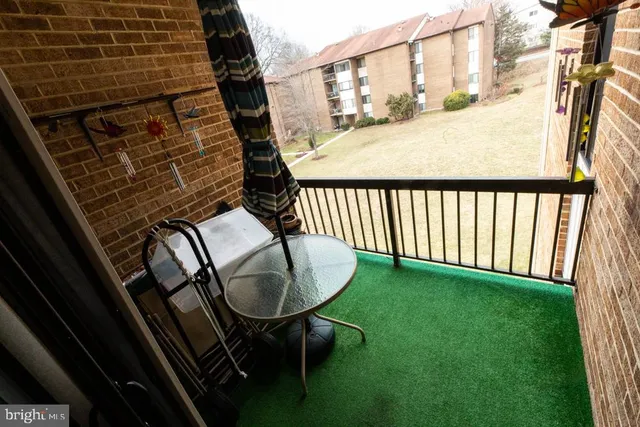 a view of a balcony with chairs