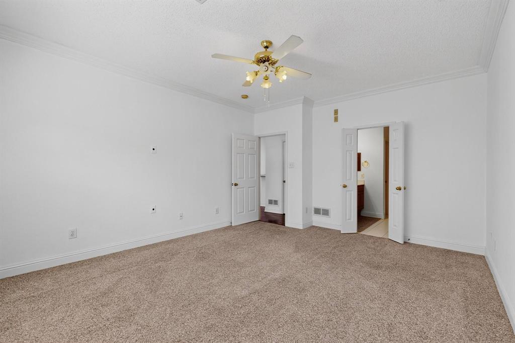 8400 Hickory Street, Unit 3102 Frisco, TX 75034 - Photo 11 of 22 a view of an empty room with a ceiling fan
