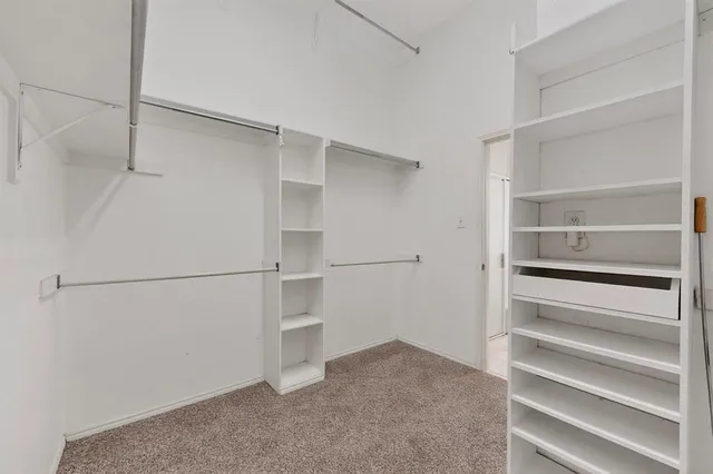 a view of an empty walk in closet