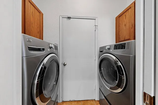 a utility room with dryer and washer