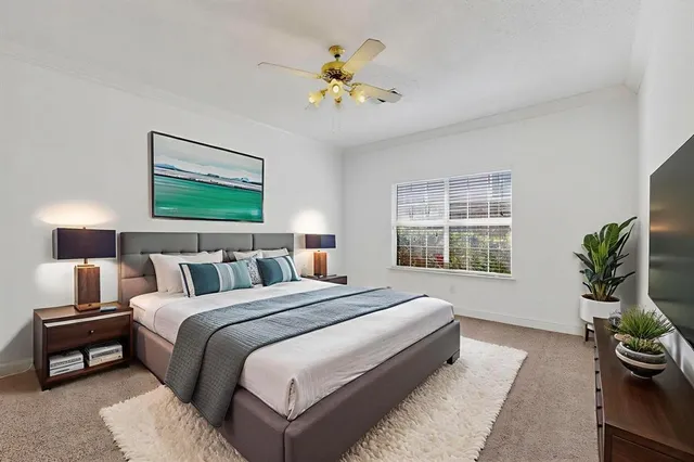 a bedroom with bed and a window