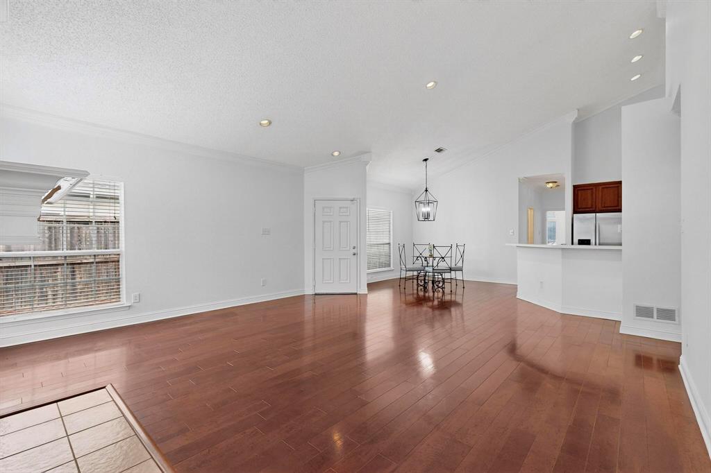 8400 Hickory Street, Unit 3102 Frisco, TX 75034 - Photo 6 of 22 a view of empty room with chair and wooden floor
