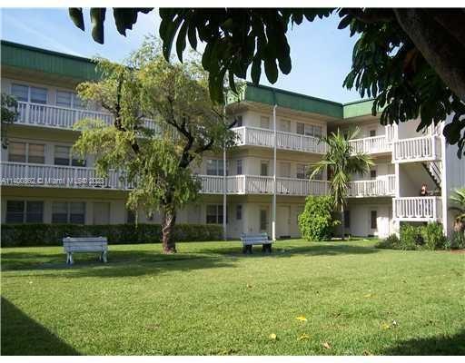 1420 Atlantic Shores Boulevard, Unit 326 Hallandale Beach, FL 33009 - Photo 11 of 16 a view of building with yard