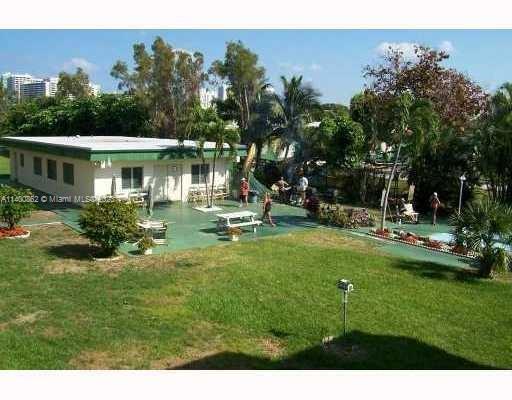 1420 Atlantic Shores Boulevard, Unit 326 Hallandale Beach, FL 33009 - Photo 14 of 16 a view of a house with a yard